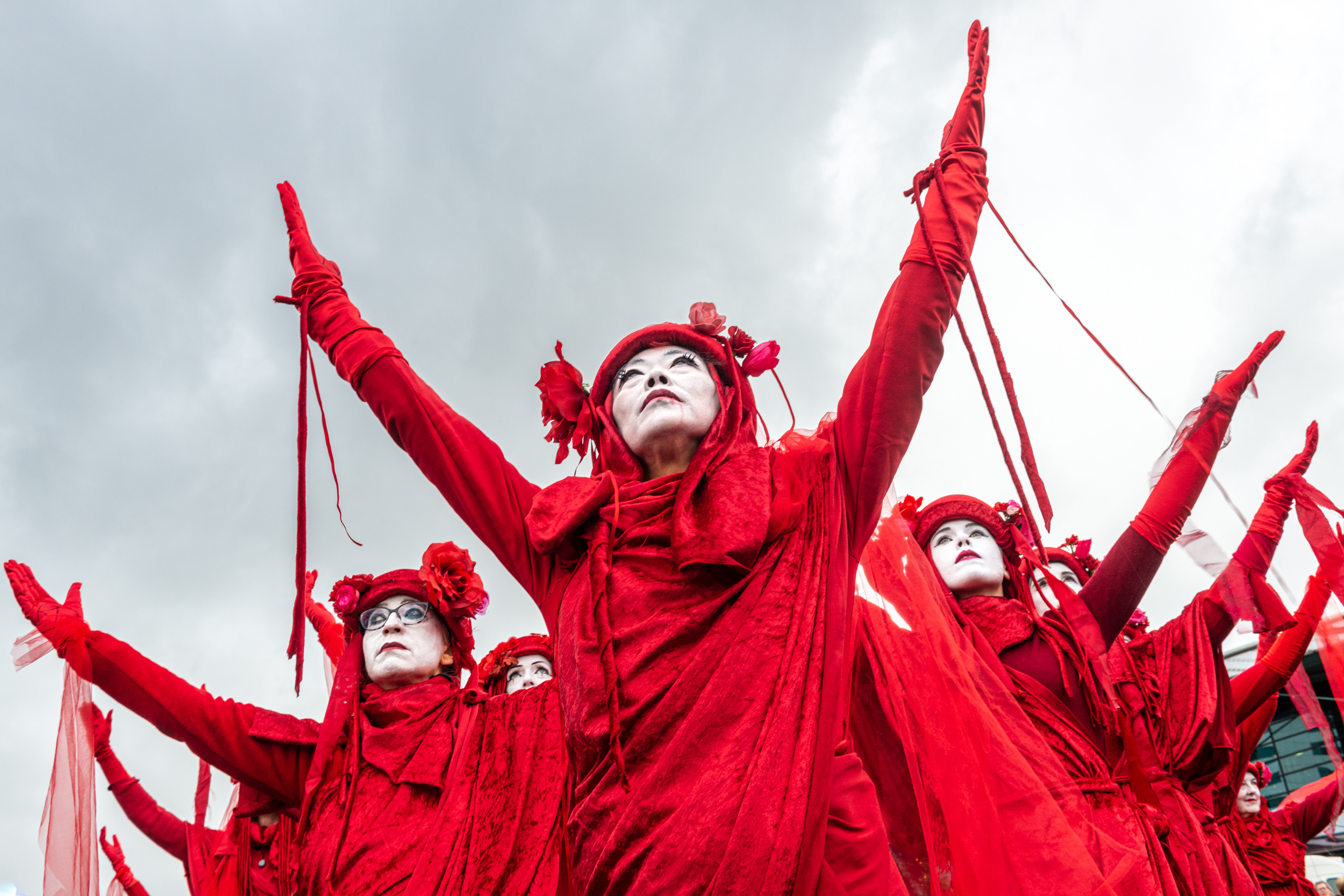 Schiphol, Climat activists from Extinction Rebellion, the Red Rebels at the airport during the Protestfestival, organised by Greenpeace. © Sabine Joosten